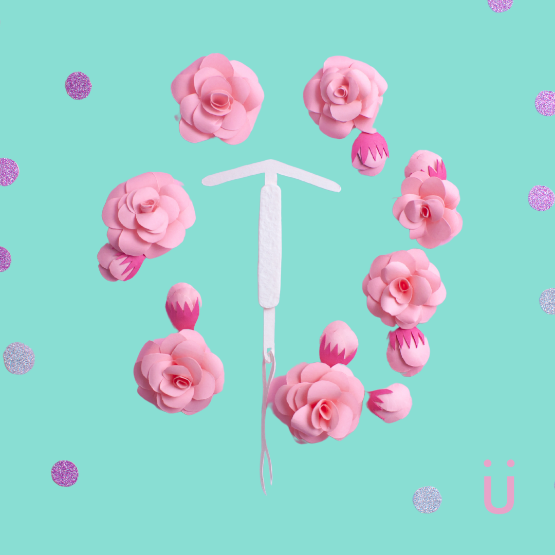 White IUD with pink flowers, symbolizing gentler IUD insertion.