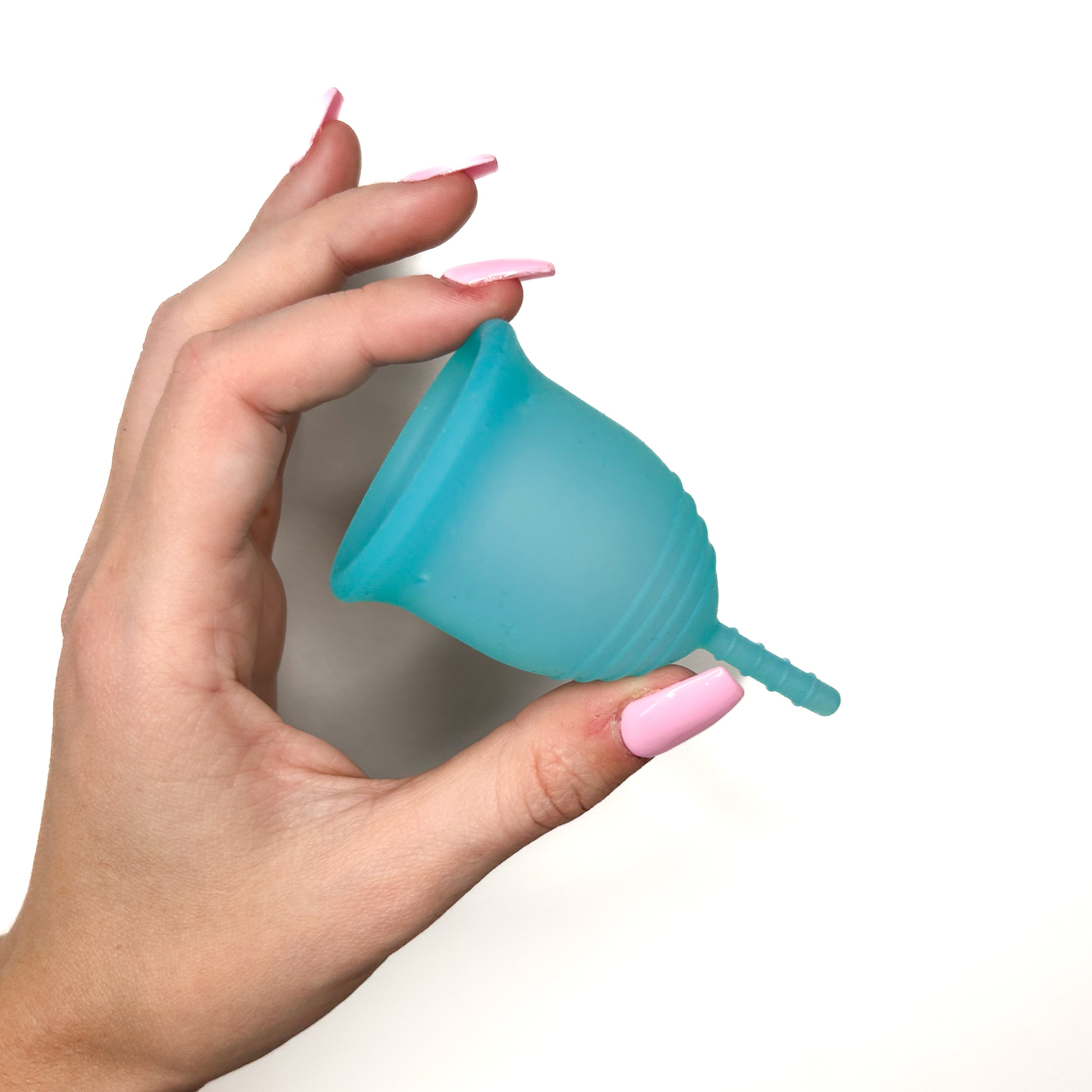 Female hand demonstrating a Menstrual Cup